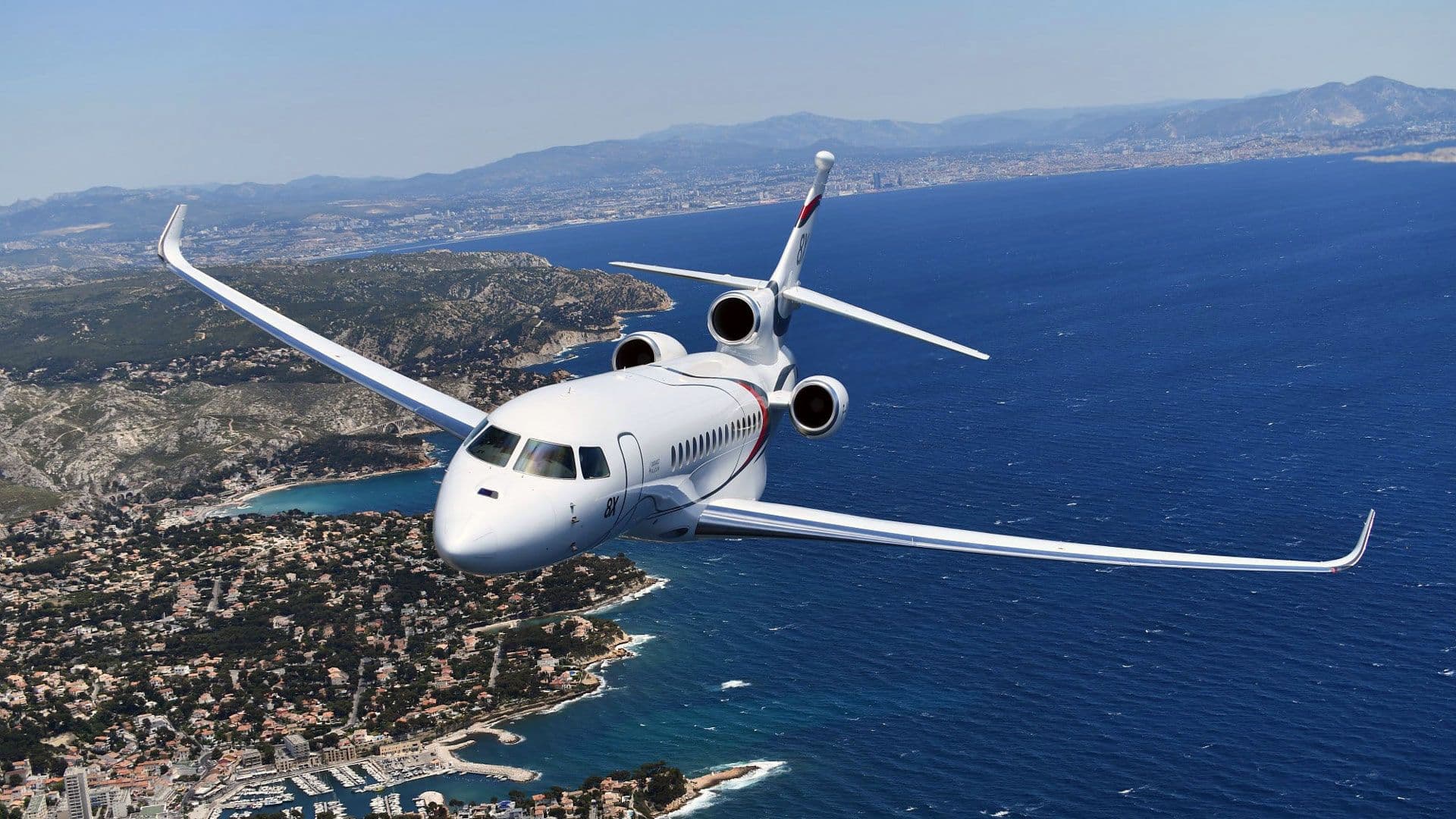 Dassault Falcon 8X ultra long range private jet with spacious luxury cabin in flight